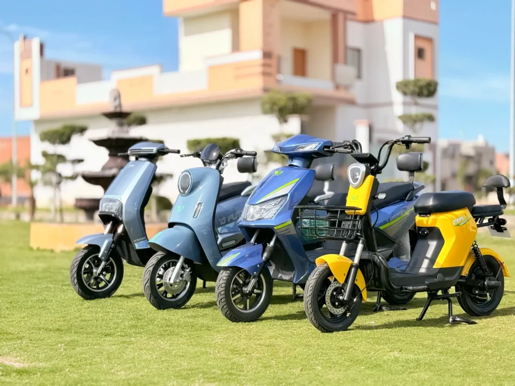 Modern electric bikes in Pakistan displayed in a lawn under sunlight